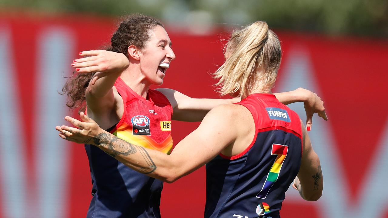 Alyssa Bannan (L) and Tayla Harris of the Demons celebrate.