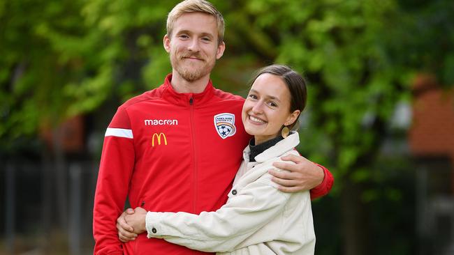 Adelaide United's Ben Halloran with his partner Helen van Laak at Linde Reserve at Stepney after the Reds star re-signed for two years. Picture: Mark Brake.