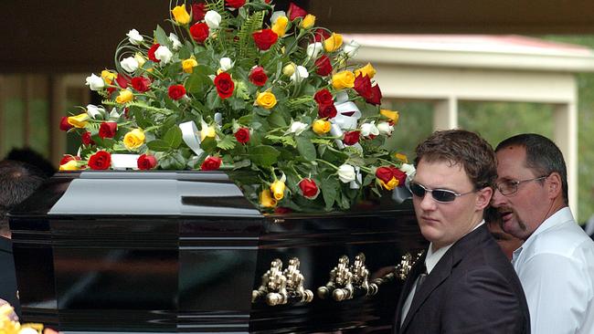 Michael Griffey’s coffin is carried out of his funeral.