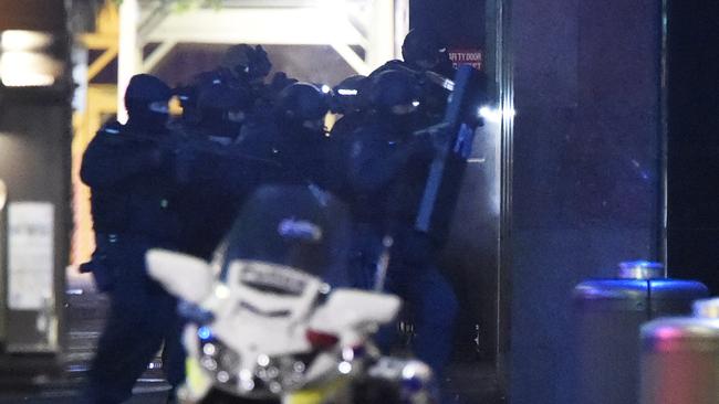 Heavily armed police outside the Lindt Cafe in Martin Place. Picture: Gordon McComiskie