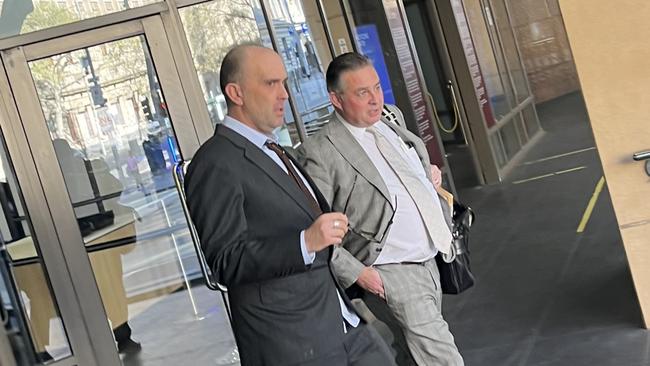 Daniel Liss (left) leaving Melbourne Magistrates' Court on September 15 with his lawyer (right).