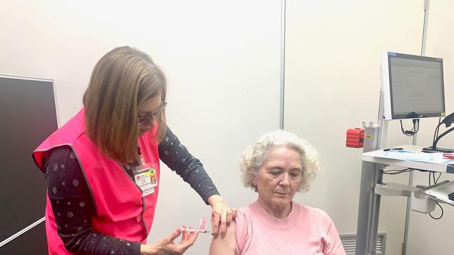 Registered nurse Tracy Harris is one of the fist to be vaccinated in the new Grafton clinic as she receives her vaccine from clinical nurse consultant Kate Norton.