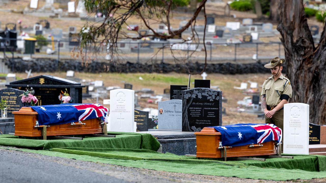 Australian Army soldier Private Henry Stevens from 12th/40th Battalion, Royal Tasmania Regiment, stands guard over the World War I veterans Private Hans John Louis Anderson and Private Henry John Way before the reinterment ceremony at the Cornelian Bay Cemetery in Hobart on Thursday. Picture: Corporal Michael Currie