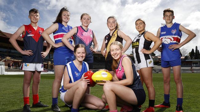 STJFL players ahead of their grand final games this weekend Front LR Sandy Bay's, Sophie Abel, 16 and North Hobart's, Claire Ransom, 16 and (rear) LR Brighton's, Riley Davie, 12, Claremont's Emma Abrahams, 16, North Hobart's Lily McConnon, 13, Kingborough's Neve Hagan, 12, Glenorchy's Talia Drake, 16 and Claremont's Jade Clark, 13. Picture: Zak Simmonds