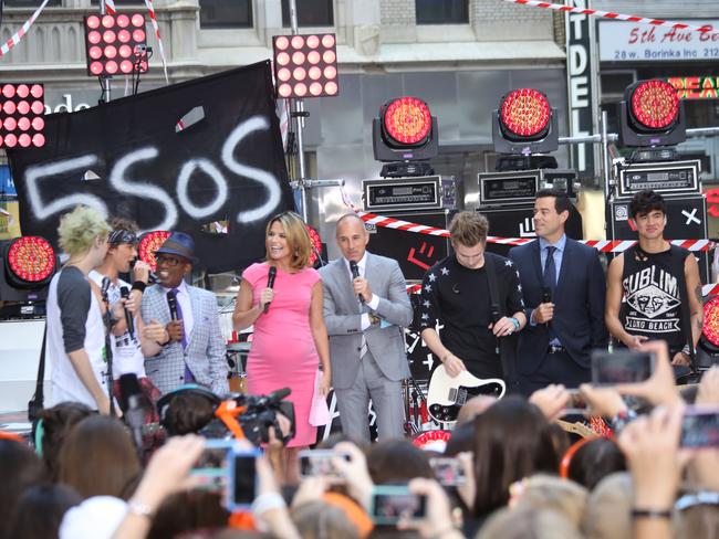 NEW YORK, NY - JULY 22: Michael Clifford, Ashton Irwin, Al Roker, Savannah Guthrie, Matt Lauer, Luke Hemmings and Carson Daly on NBC's 