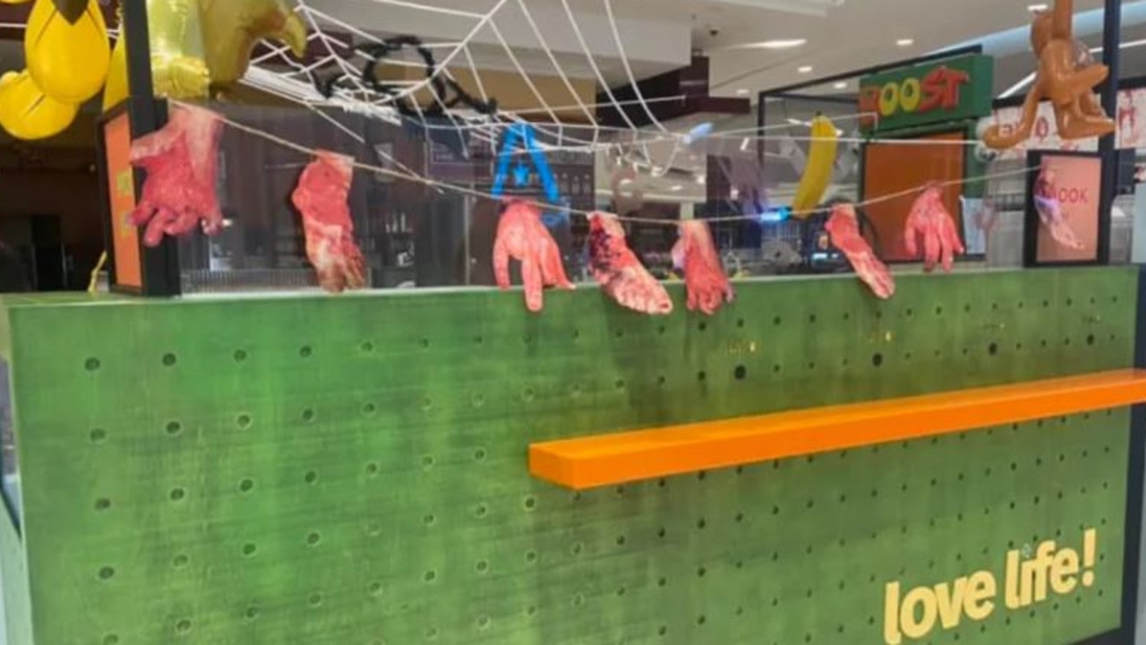 Cardboard cutouts of bloodied hands and feet were hung across the store. Picture: Facebook