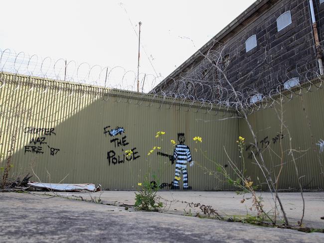 Artwork remains on an abandoned prisoner yard. Picture: George Salpigtidis