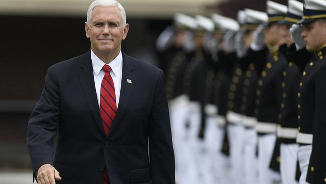 Vice-President Mike Pence is saluted as he arrives to speak at a commencement ceremony for the US Coast Guard Academy in New London, Connecticut, yesterday. Picture: AP
