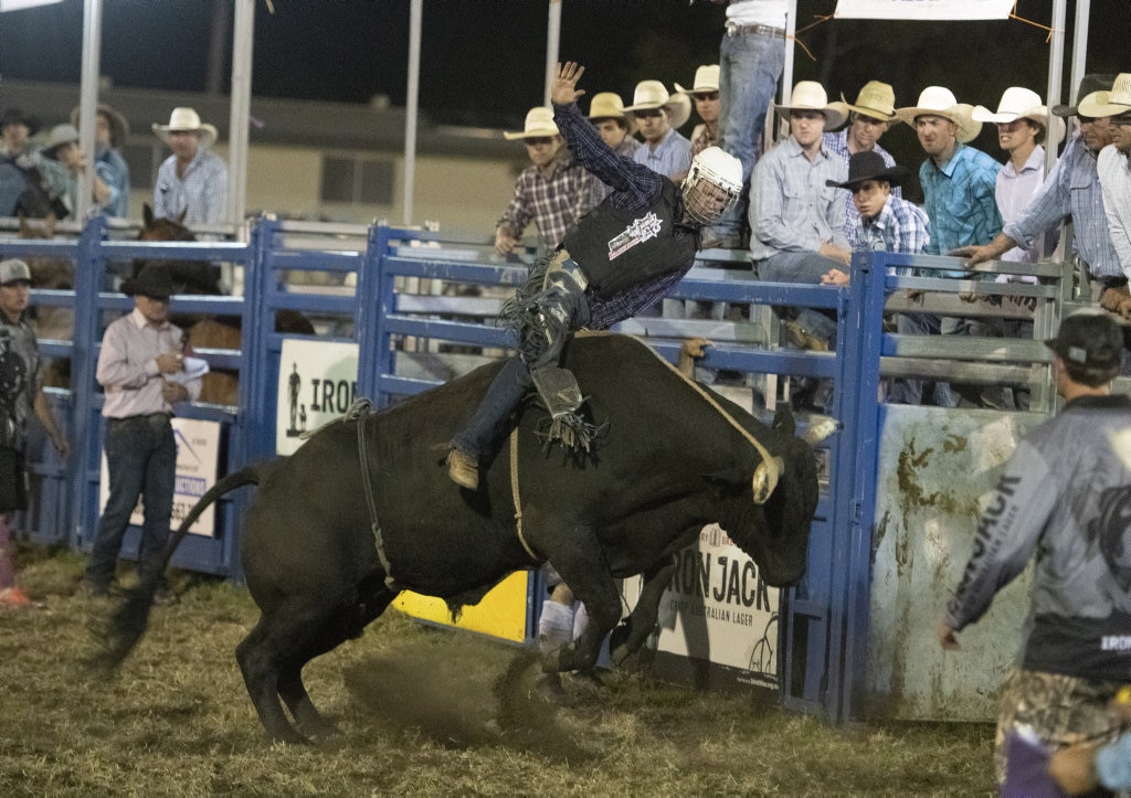 Josh Jones on his way to qualifying for the final in the open bullride at the Lawrence Twilight Rodeo. Picture: Adam Hourigan