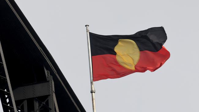 The Aboriginal flag has been flying beside the Australian flag on top of the Harbour Bridge on for NAIDOC week. Picture: Damian Shaw