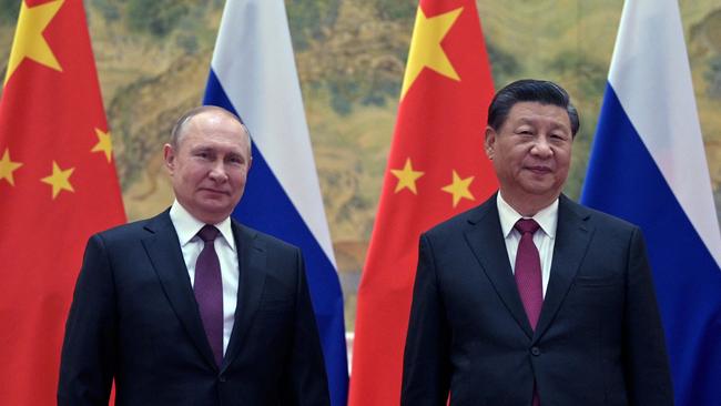 Russian President Vladimir Putin and Chinese President Xi Jinping pose during a meeting in Beijing on February 4. Picture: AFP