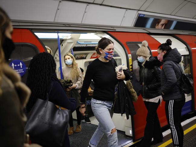 Passengers exit a London Underground tube train during the morning rush hour in London on Wednesday. Picture: AFP