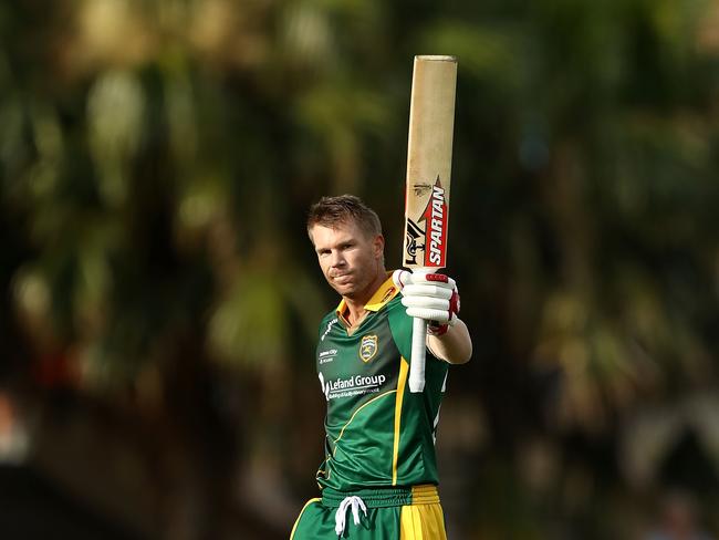 David Warner celebrates his century for Randwick-Petersham. Picture: Getty