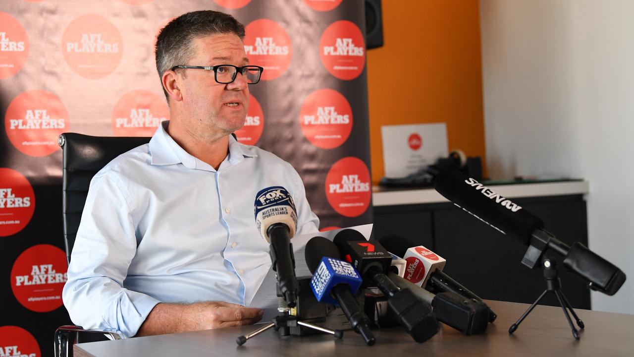 The AFL Players' Association (AFLPA) CEO Paul Marsh addresses the media on the AFLPA Boards position regarding COVID-19 during a press conference at AFLPA Office in Melbourne, Tuesday, March 17, 2020. Marsh has announced that both AFL and AFLW playing groups are prepared to play as soon as they are given the green light by the AFL. (AAP Image/James Ross) NO ARCHIVING