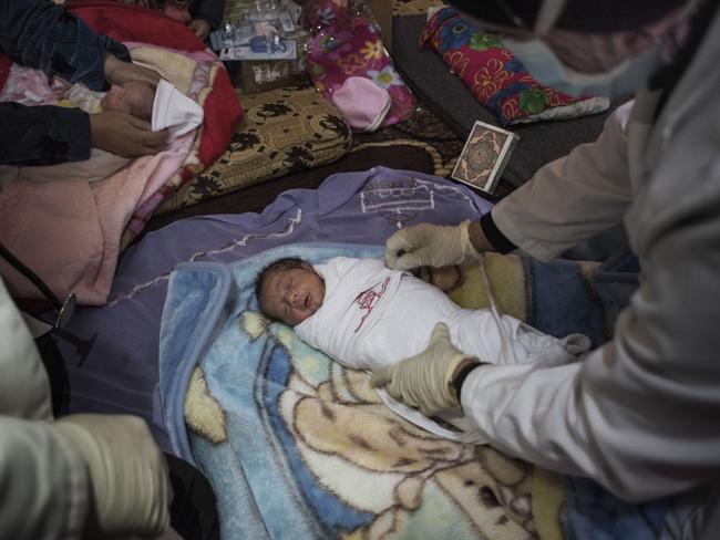 Syrian refugees in Lebanon: Triplets born in a snowstorm | news.com.au ...