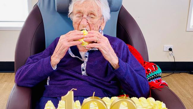 Karinity Carinya aged care resident Mavis Cumner enjoys some cake as part of her 100th birthday celebration. (Photo: Supplied)