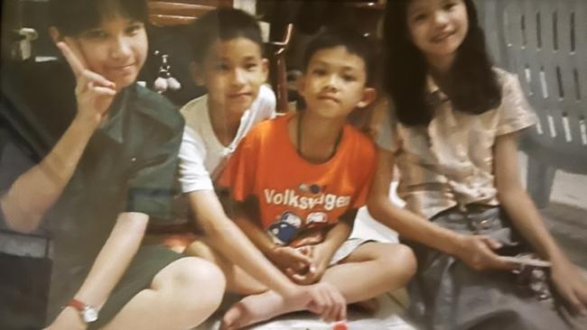 Noy’s favourite picture of her four children, Dom in the orange shirt.