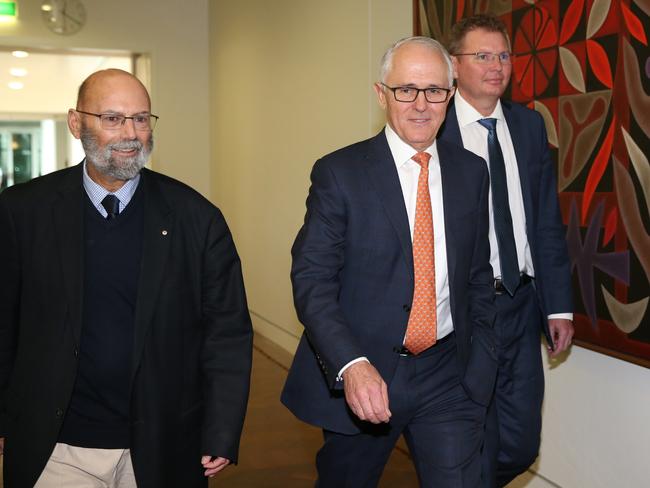 Mr Laundy (right) was a key ally of Malcolm Turnbull, who is pictured arriving for the leadership spill with Arthur Sinodinos. Picture: Kym Smith