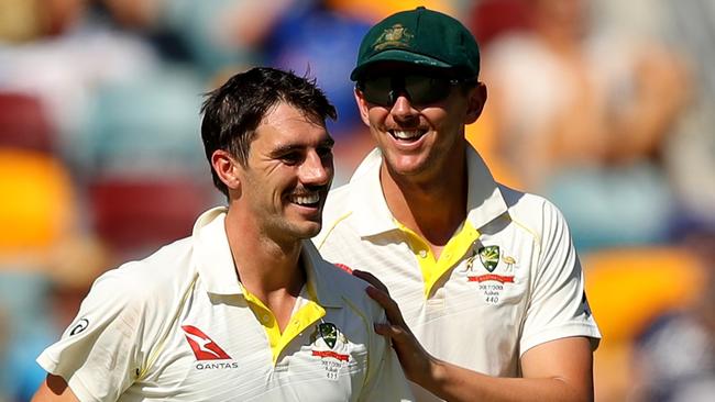 Pat Cummins of Australia is congratulated by Josh Hazlewood. (Photo by Cameron Spencer/Getty Images)