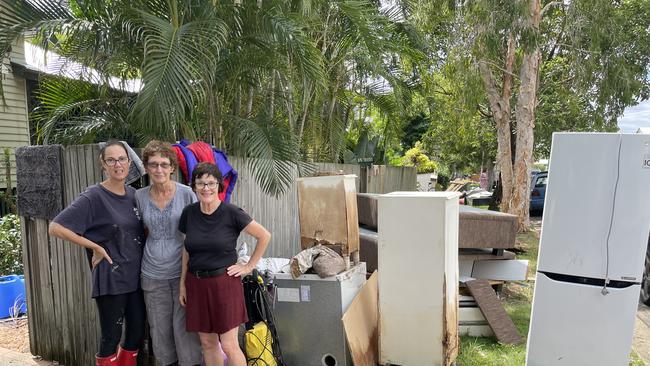 (L to R) Jo Manthey, Kay Elsden and Di Faulkner outside Ms Elsden's flood-affected home.