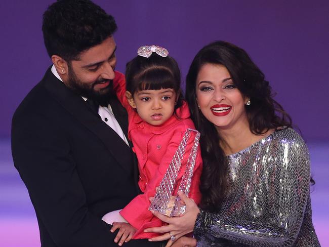 Former Miss World Aishwarya Rai speaks on stage with husband Abhishek Bachchan and daughter Aaradha, during the Miss World 2014 final. Picture: Joel Ryan / Invision / AP