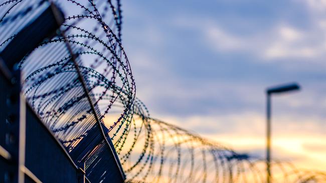 barbed razor wire jail prison istock