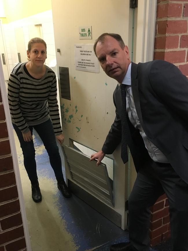 Caulfield South Primary School school council president Melanie Gordon and Caulfield state Liberal MP David Southwick inspect the stinky loos.