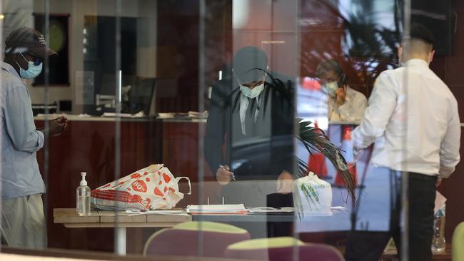 Security staff receive a parcel from an Uber driver at the Mercure Hotel Perth. (Photo by Paul Kane/Getty Images)