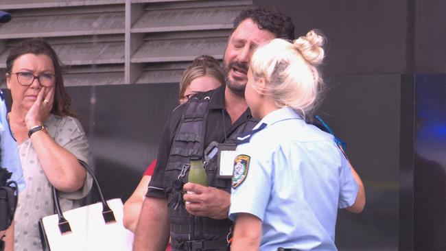 Police comfort witnesses at the scene. Picture: OnScene Bondi.