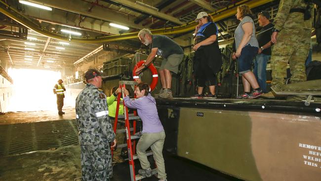 Crew and family help others aboard. Picture: David Caird