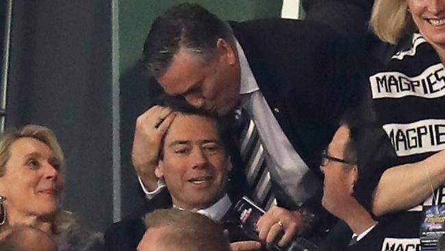 Eddie McGuire plants one on the head of Gillon McLachlan during the 2018 Preliminatry Final, Picture: AFL Media