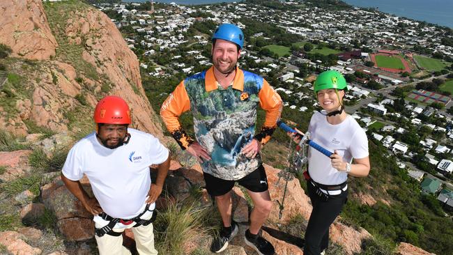 Townsville Hike and Explore are holding a Zip Line event on Castle Hill. Simon Leedie from Dawn Services, with Michael Pugh from Townsville Hike and Explore and Jade Nelson from the Women's Society. Picture: Evan Morgan