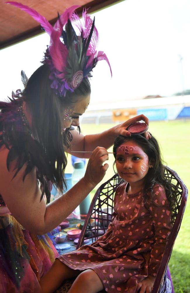 Raavi Kaur, 3, getting her face painted at the Chief Minister's Cup Day at the Darwin Turf Club on Saturday, July 15.