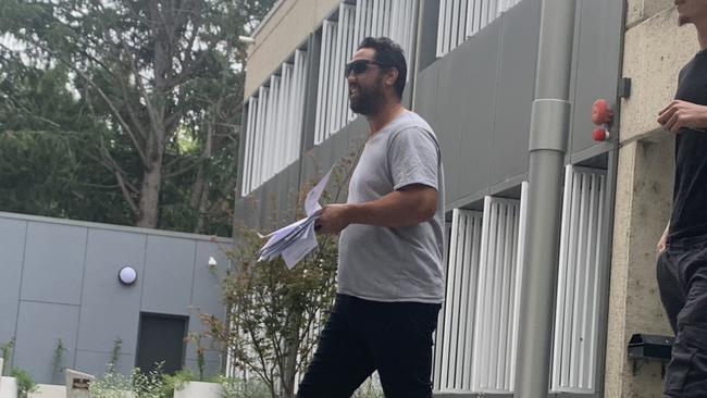 Brent Kite (left) leaves Queanbeyan Local Court with a supporter (right) on February 28 2022. Picture: Julia Kanapathippillai