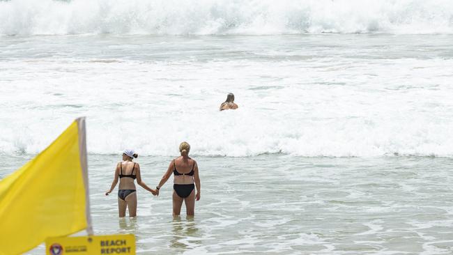 Beachgoers at Mooloolaba spit. Picture: Lachie Millard