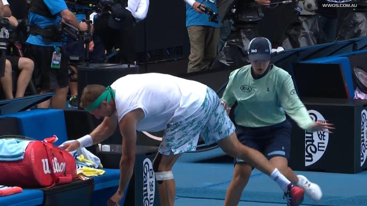 A ball kid accidentally runs into Tennys Sandgren.