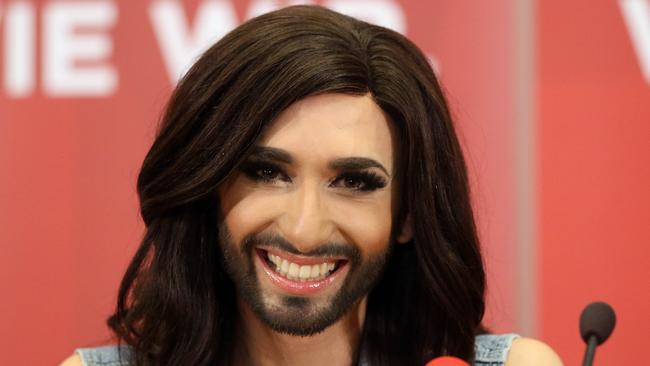 Hair I am ... Eurovision Song Contest winner Conchita Wurst beams after making a triumphant return home to Austria.