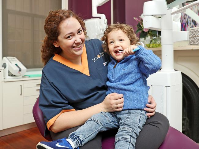 Dentist Dilara Yashin makes sure her son Moony brushes his teeth regularly. Picture: Tim Hunter