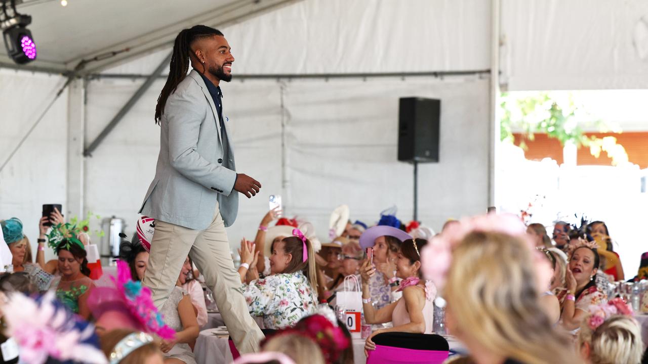 Northern Pride player Nat McGavin walks in the fashion parade at the Cairns Amateurs High Tea, held under the waterfront marque on the Cairns Esplanade Eastern Events lawn. Picture: Brendan Radke