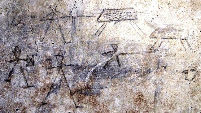 The child’s sketch of two gladiators squaring off while two others, armed with spears, close in on a pair of wild boar.