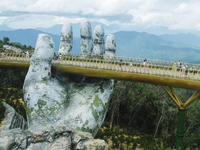 8/15Golden Bridge, Vietnam Suspended 1400m above sea level in Vietnam’s Ba Na hills, the aptly named Golden Bridge is held up by two giant stone hands. The $2 billion shimmering structure extends along 150m and opened in June 2018 in a bid to lure more tourists, which so far has proven to be a success with people flocking to the bridge daily. 
 LOCATION:
 Sun World Bà Nà Hill, Hoà Phú, Hòa Vang, Đà Nẵng, Vietnam