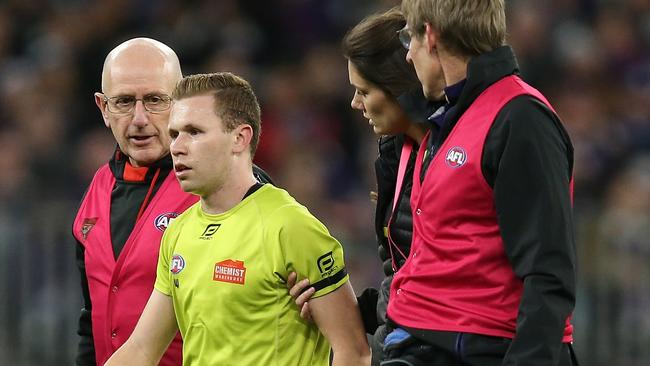 Whetton is helped off the ground. Picture: Getty Images