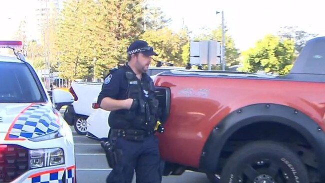 Police beside the car which was shot at in Mermaid Waters. Picture: 9News Gold Coast.