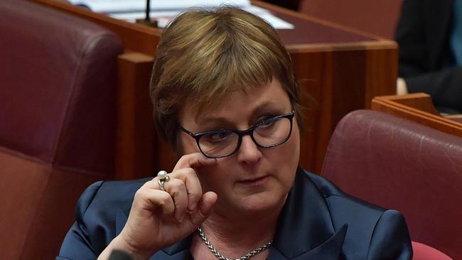 Senator Linda Reynolds wipes a tear during Question Time in the Senate on Thursday. Picture: Getty