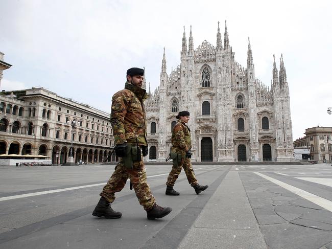 Italian soldiers patrol the square facing Duomo gothic cathedral in downtown Milan, Italy. Picture: AP