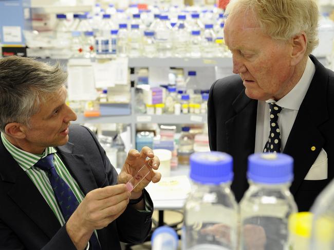 Ron Walker, pictured with Prof Grant McArthur at the Peter MacCallum Cancer Centre, received lifesaving immunotherapy.