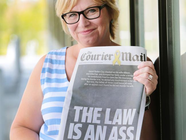 Domestic violence campaigner Rosie Battie with the <i>Courier Mail</i>’s front page. Picture: Lachie Millard