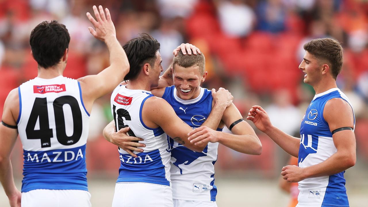 SYDNEY, AUSTRALIA - MARCH 16: Zane Duursma of the Kangaroos celebrates with team mates after kicking a goal during the round one AFL match between Greater Western Sydney Giants and North Melbourne Kangaroos at ENGIE Stadium, on March 16, 2024, in Sydney, Australia. (Photo by Matt King/AFL Photos/via Getty Images )