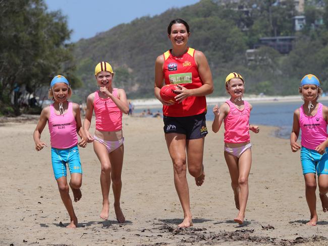 Gold Coast SUNS AFLW Lauren Ahrens with nippers on the beach at Currumbin. Left to right they are, Ari Hamill 9, Mila-May Berg 9, Lauren Ahrens, Billie Berg7 and Leo Hamill 7. Picture Glenn Hampson