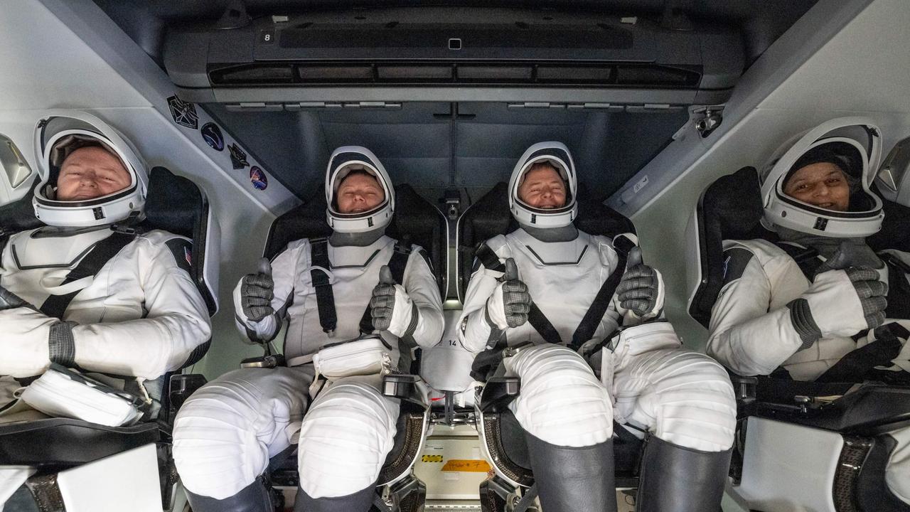 NASA astronaut Butch Wilmore, Roscosmos cosmonaut Aleksandr Gorbunov, NASA astronauts Nick Hague and Suni Williams inside a SpaceX Dragon spacecraft on board the SpaceX recovery ship. Picture: Keegan Barber/NASA/AFP